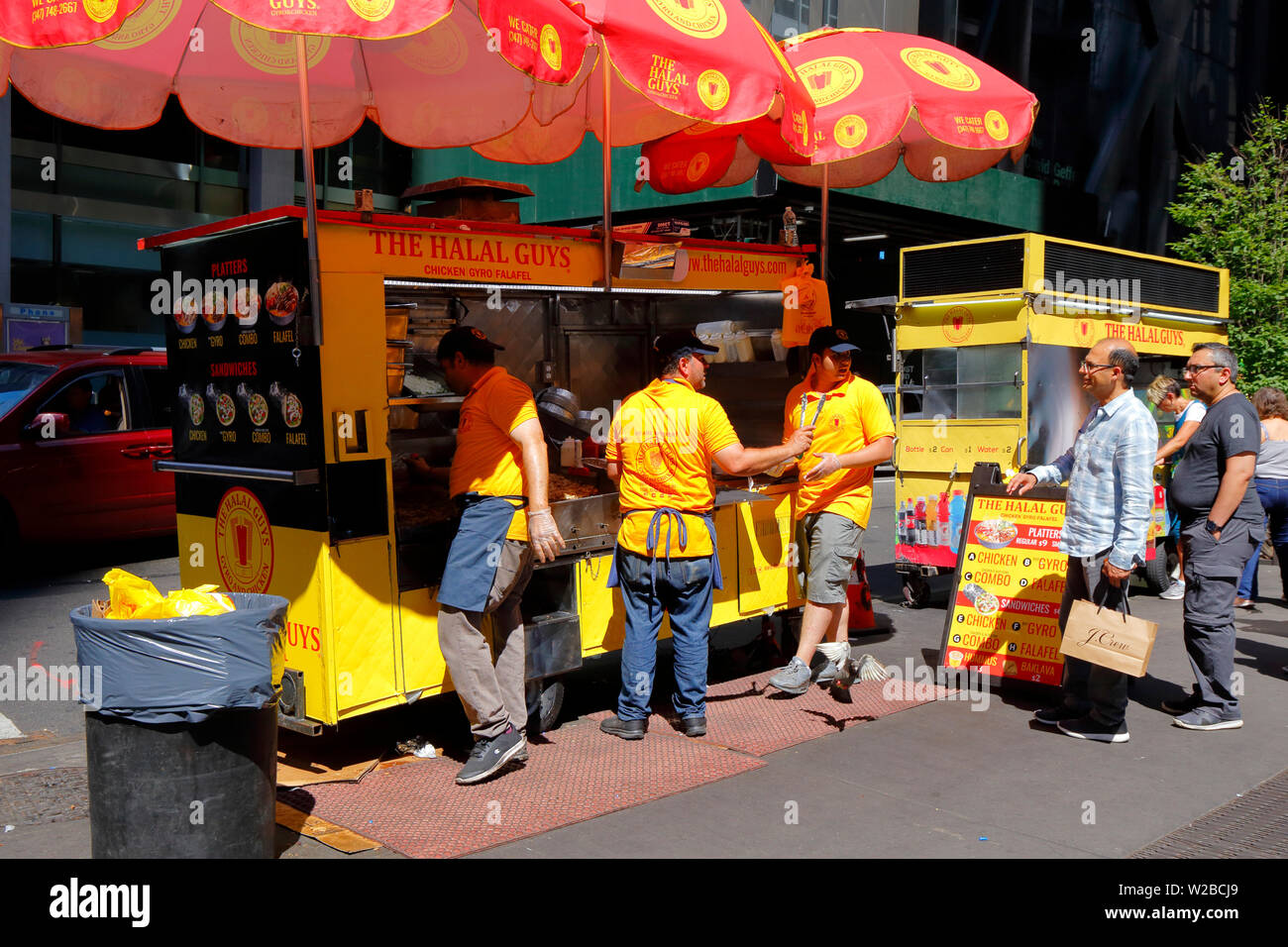 A Halal Guys food cart in midtown Manhattan, New York, NY`` Stock Photo